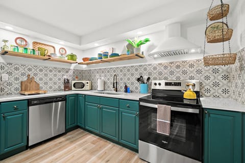 Deluxe Condo | Private kitchen | Full-size fridge, microwave, oven, stovetop