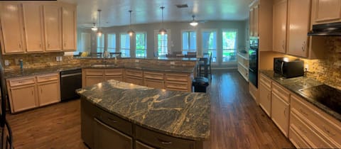 Spacious Kitchen with Island, ample counterspace and Breakfast Bar seating.
