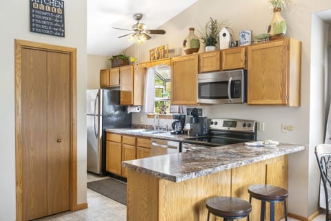 Whip up a delicious meal in the fully equipped kitchen - the heart of your cozy condo that's sure to inspire your inner chef!