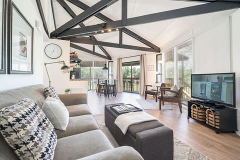 Spacious open-concept living and dining area with modern décor and a welcoming atmosphere.