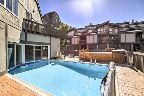 indoor/outdoor pool with outdoor hot tub that seats 8