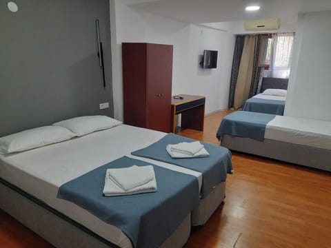 Comfort Quadruple Room | Premium bedding, desk, free WiFi, bed sheets