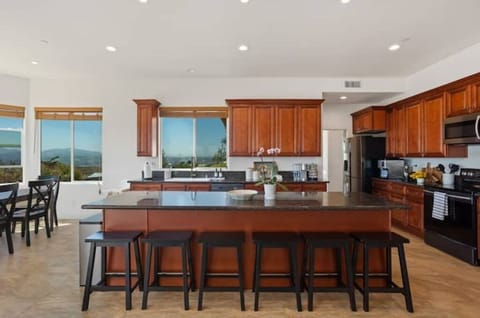 Spacious, fully stocked kitchen with cookware/dinnerware for a large group.