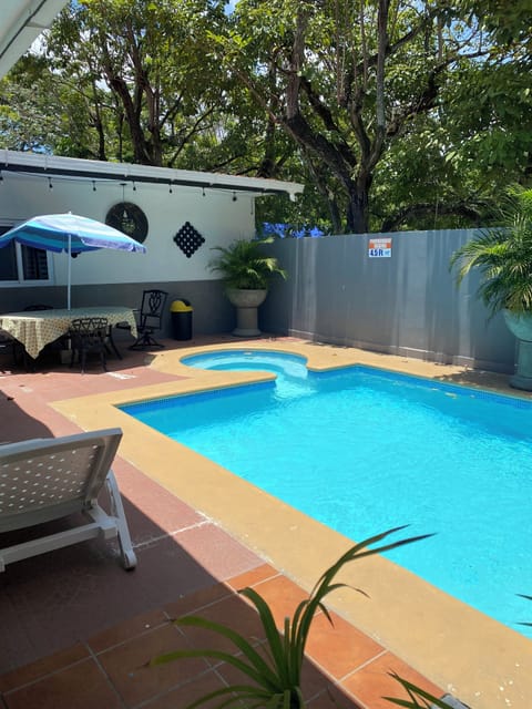 2 outdoor pools, open 8:00 AM to 7:00 PM, pool umbrellas