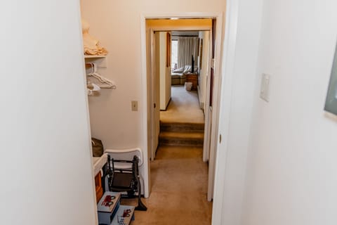 Packnplay, high chair, changing pad, and step stool stored in the upstairs hall
