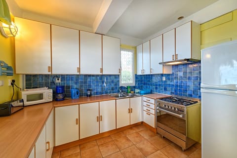 Moonlight, 2 Bedroom Apartment | Private kitchen | Full-size fridge, microwave, oven, stovetop