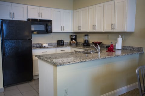 Suite, 1 Bedroom | Private kitchen | Fridge, microwave, stovetop, coffee/tea maker