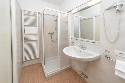 Combined shower/tub, free toiletries, hair dryer, slippers
