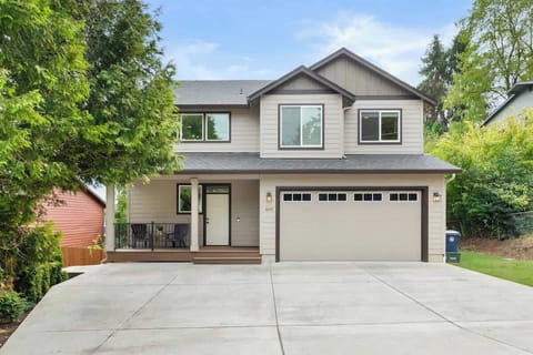Front driveway with parking for at least 3 vehicles. Guest suite entrance is down the left side of the home. 