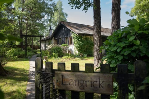 Langrick garden gate and house behind