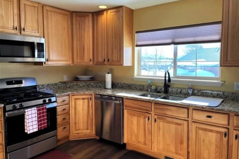 Stainless steel refrigerator, dishwasher, microwave, and range/oven combination