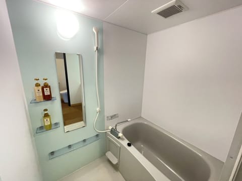 Family Quadruple Room | Bathroom | Hair dryer, slippers, bidet, towels