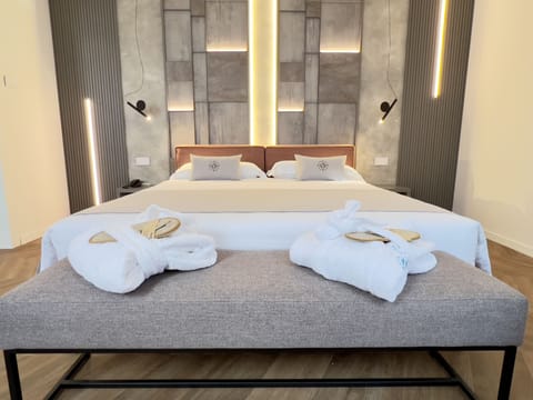 Deluxe Quadruple Room, Jetted Tub | Premium bedding, down comforters, in-room safe, desk