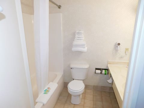 Double Queen Bed - Non-Smoking | Bathroom | Combined shower/tub, free toiletries, hair dryer, towels