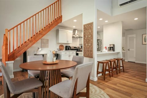 Dining area with vaulted ceilings and sliders to covered lanai