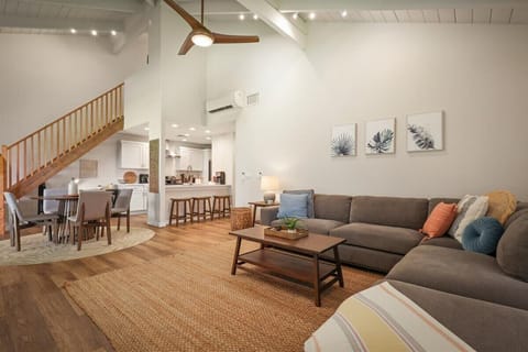 Open concept layout connects living room, dining, and kitchen