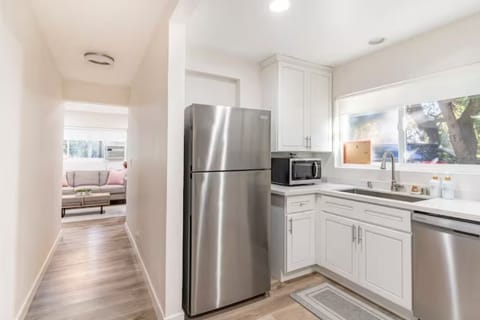 Kitchen with Ice Trays, microwave, and basic necessities are provided.