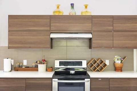 Open kitchen stocked with cooking supplies & spices