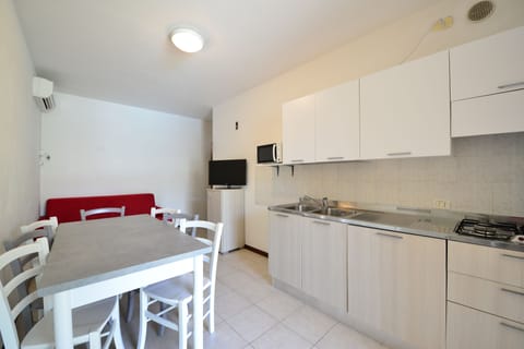 Apartment, 1 Bedroom (Glicine) | Private kitchen | Fridge, stovetop, coffee/tea maker, cookware/dishes/utensils