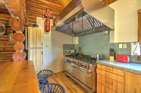 Kitchen with industrial stove and ovens