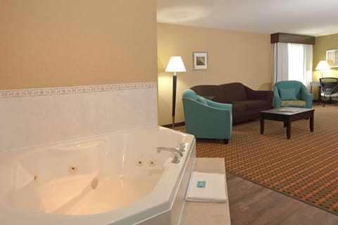 Suite, 1 King Bed, Fireplace (Jetted Tub, Sofa) | Desk, iron/ironing board, free cribs/infant beds, free WiFi