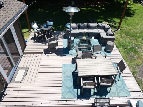 Outdoor Deck complete with Dining table, Fire Pit, and BBQ.