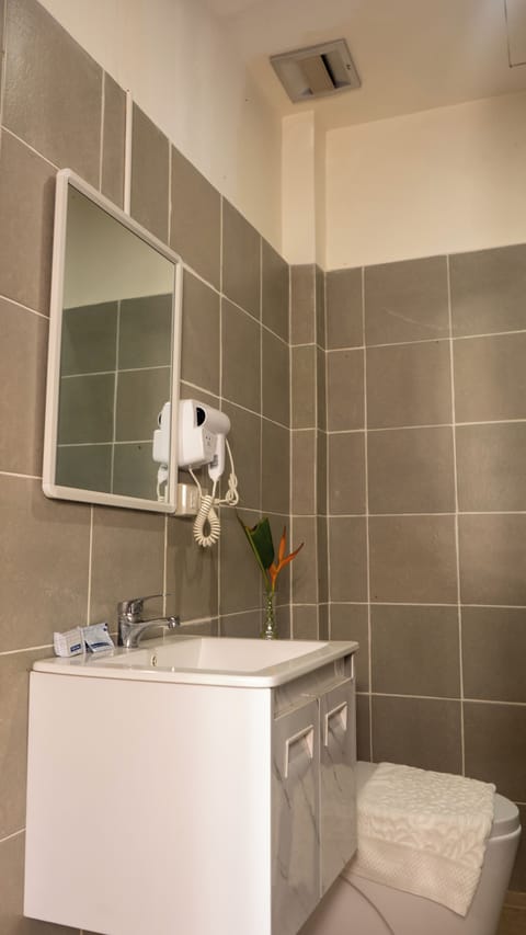 Elite Room, 2 Queen Beds | Bathroom | Shower, hair dryer, towels, soap