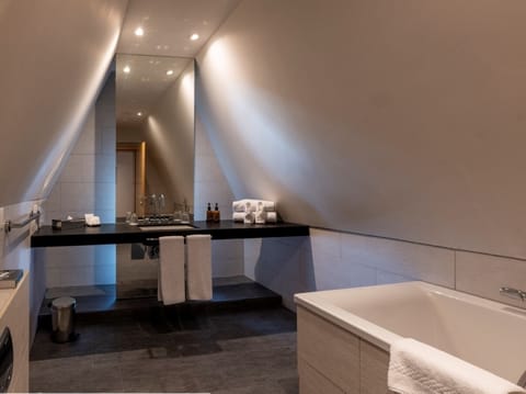 Suite, Lake View | Bathroom | Shower, designer toiletries, hair dryer, bathrobes