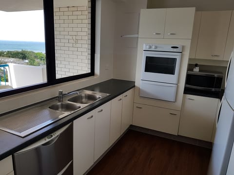 Apartment, 3 Bedrooms, Ocean View (1 Queen & 4 Singles) | Private kitchenette | Full-size fridge, microwave, oven, stovetop