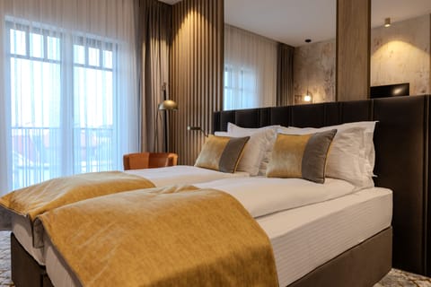 Deluxe Double Room | Minibar, in-room safe, individually decorated, individually furnished