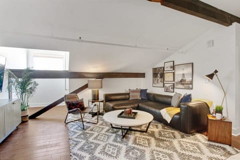 Spacious living room with 65" TV and sectional couch