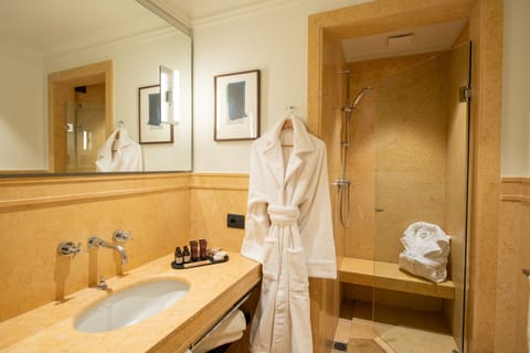 Junior Suite | Bathroom | Rainfall showerhead, hair dryer, bathrobes, slippers