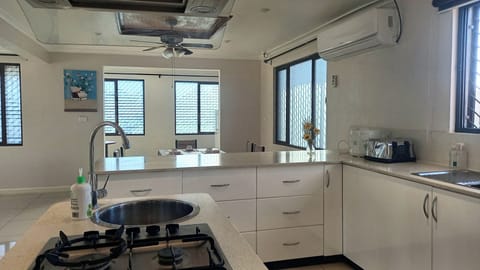 Executive Condo | Private kitchen | Full-size fridge, microwave, oven, stovetop