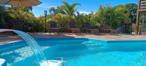 Outdoor pool, open 8:00 AM to 8:00 PM, pool umbrellas, sun loungers