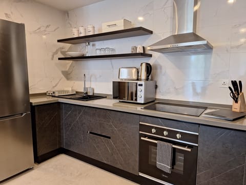 Standard Apartment, 1 Bedroom, Balcony, Partial Ocean View (308) | Private kitchen | Full-size fridge, microwave, oven, stovetop