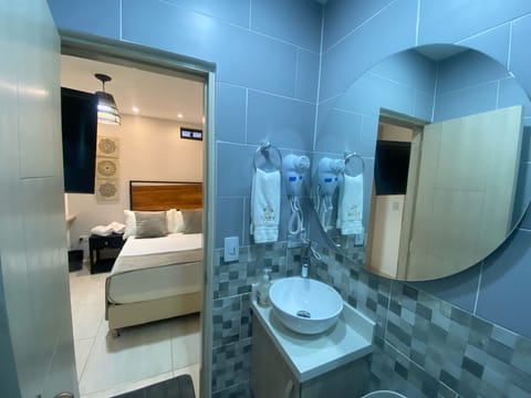 Traditional Room | Bathroom | Shower, rainfall showerhead, hair dryer, towels