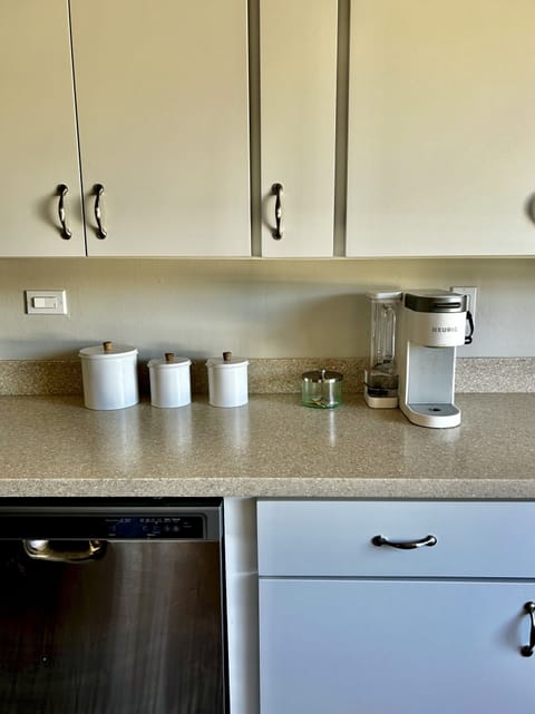 Kuerig coffee maker with pods provided.