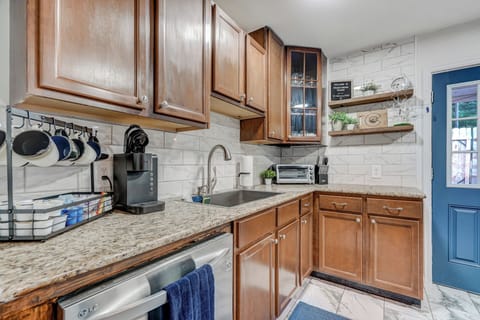 Kitchen is stocked with all utensils and supplies.