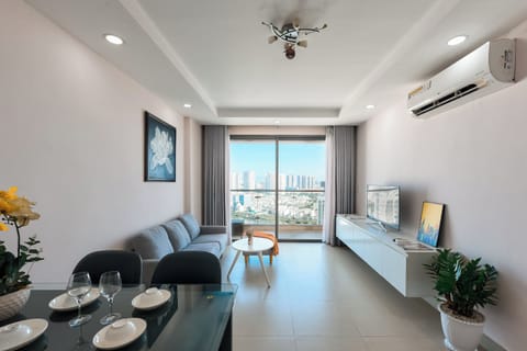 Deluxe Apartment | Living area | 50-inch Smart TV with cable channels, Netflix, streaming services