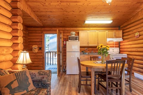 One Bedroom Cabin, King Bed | Living area | 32-inch flat-screen TV with cable channels, TV, streaming services