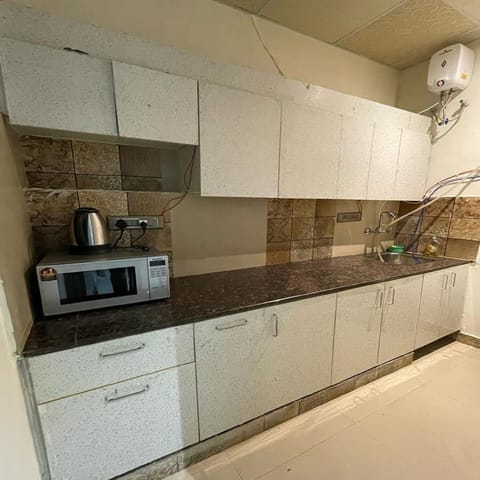 Rooftop 2 BHK Terrace Apartment | Private kitchen | Fridge, microwave, electric kettle