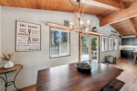 Cozy dining space with rustic charm and forest views—perfect for family meals, game nights, and lingering conversations.
