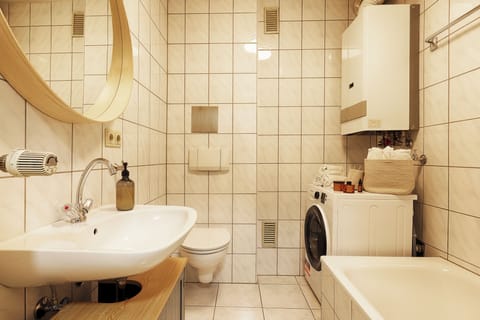 City Apartment | Bathroom | Hair dryer, towels, soap, shampoo