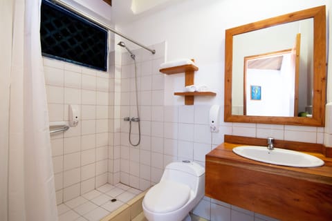 Family Triple Room | Bathroom | Shower, hair dryer, towels