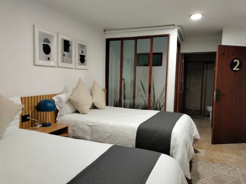 Basic Quadruple Room (2) | Minibar, individually decorated, free WiFi, bed sheets