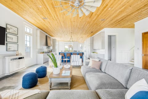 Large open-concept living, kitchen, and dining areas, where conversations flow and laughter echoes. 