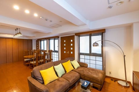 Luxury Apartment | Living area | 50-inch flat-screen TV with cable channels