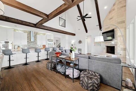 Cook at home and never miss out on the fun. Modern and open kitchen/family room with a view.