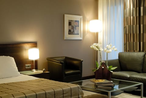 Junior Suite | Living area | 20-inch LCD TV with satellite channels, Smart TV, pay movies