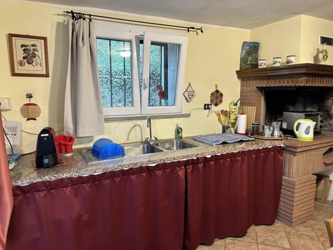 Chalet, 1 Bedroom (La Casetta del Bosco) | Private kitchen | Mini-fridge, cookware/dishes/utensils, cleaning supplies, dining tables